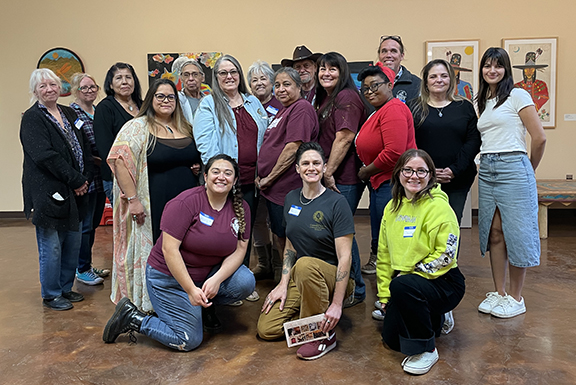 Cherokees of the Inland Empire weaving flat reed mats at the Dorothy Ramon Learning Center in Banning, CA